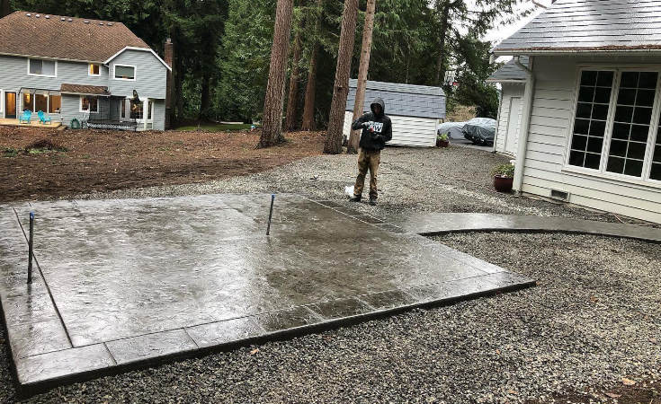 Stained and stamped concrete backyard patio