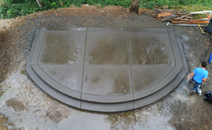 Large concrete patio in Seattle backyard 